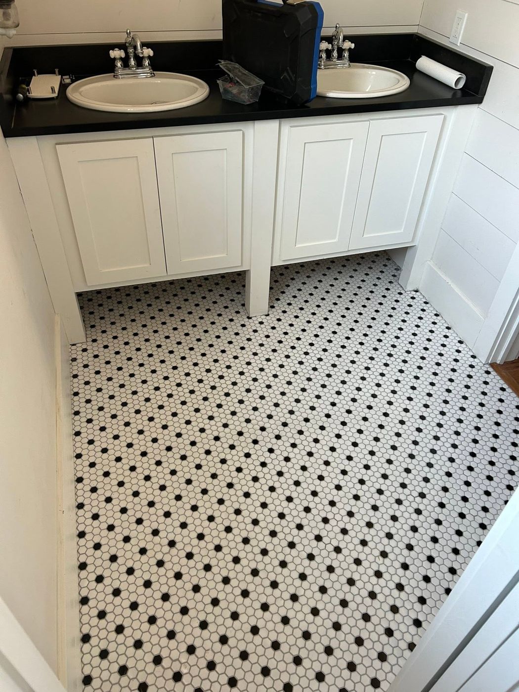 Double Vanity: New double vanity on a classic black-and-white hex floor.