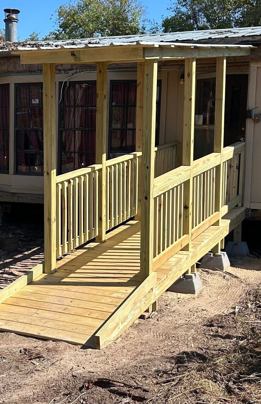 Covered Wheelchair Ramp: A covered porch and ramp for safe, easy access.