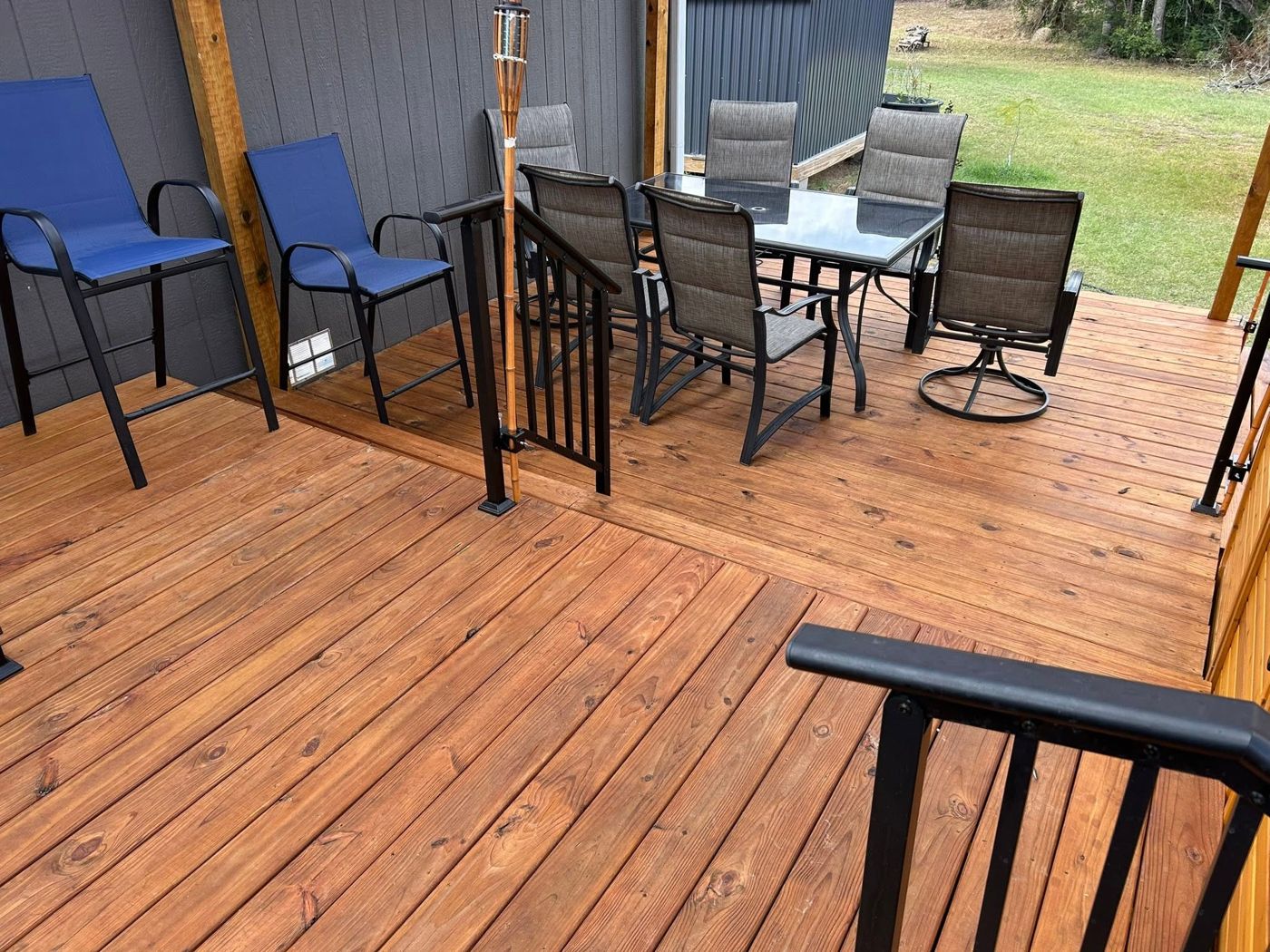 Deck Dining Area: Room for the whole family, with black metal railings.