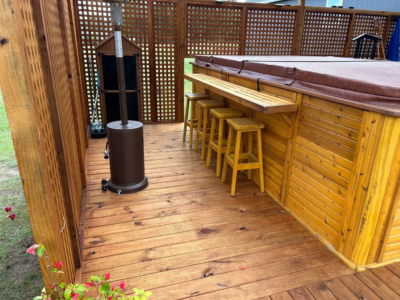 Hot Tub Bar Ledge: Cedar-clad hot tub surround with a built-in bar ledge and matching stools.