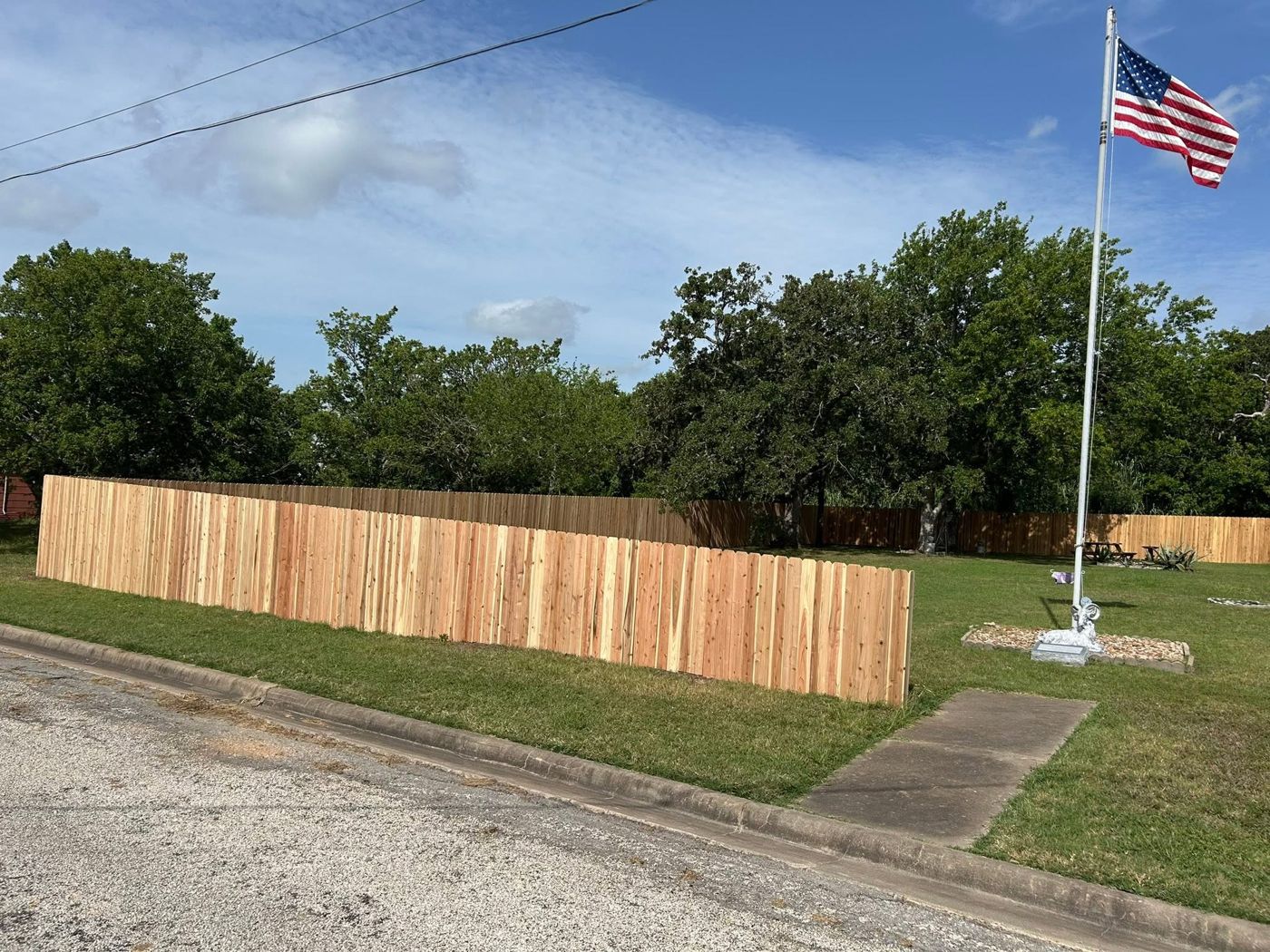 Privacy Fence: New wood privacy fence along the street side of a property.