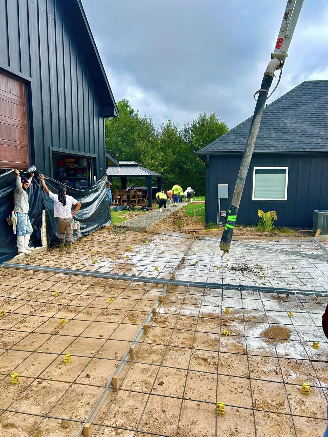 Pour Day: Rebar grid set and concrete going in for the shop driveway.