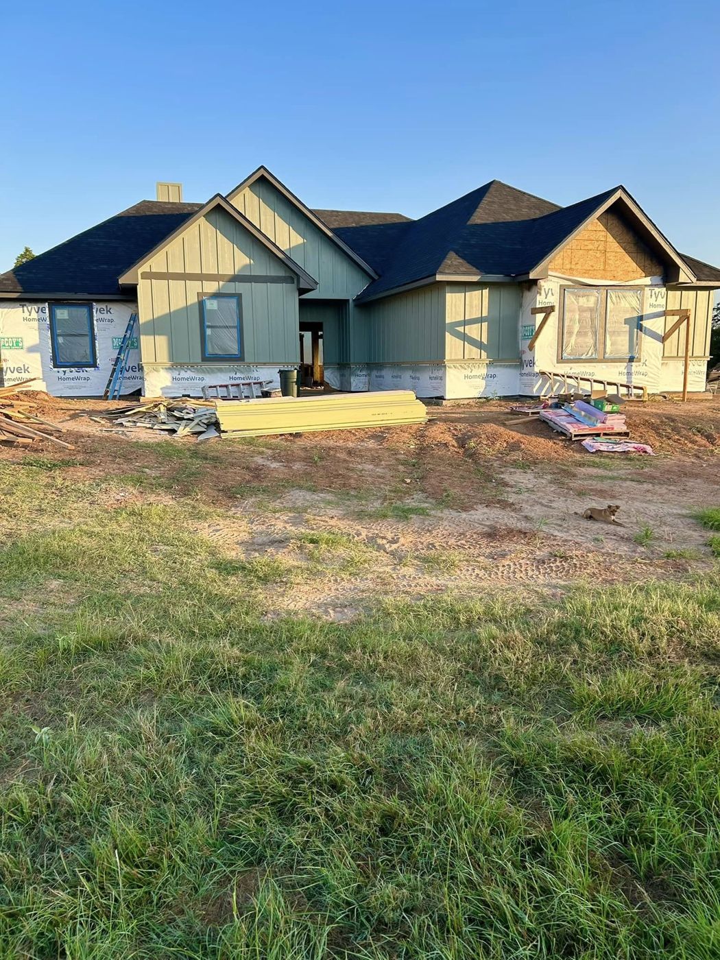 Siding Goes On: Board-and-batten siding and new roof on the same home.
