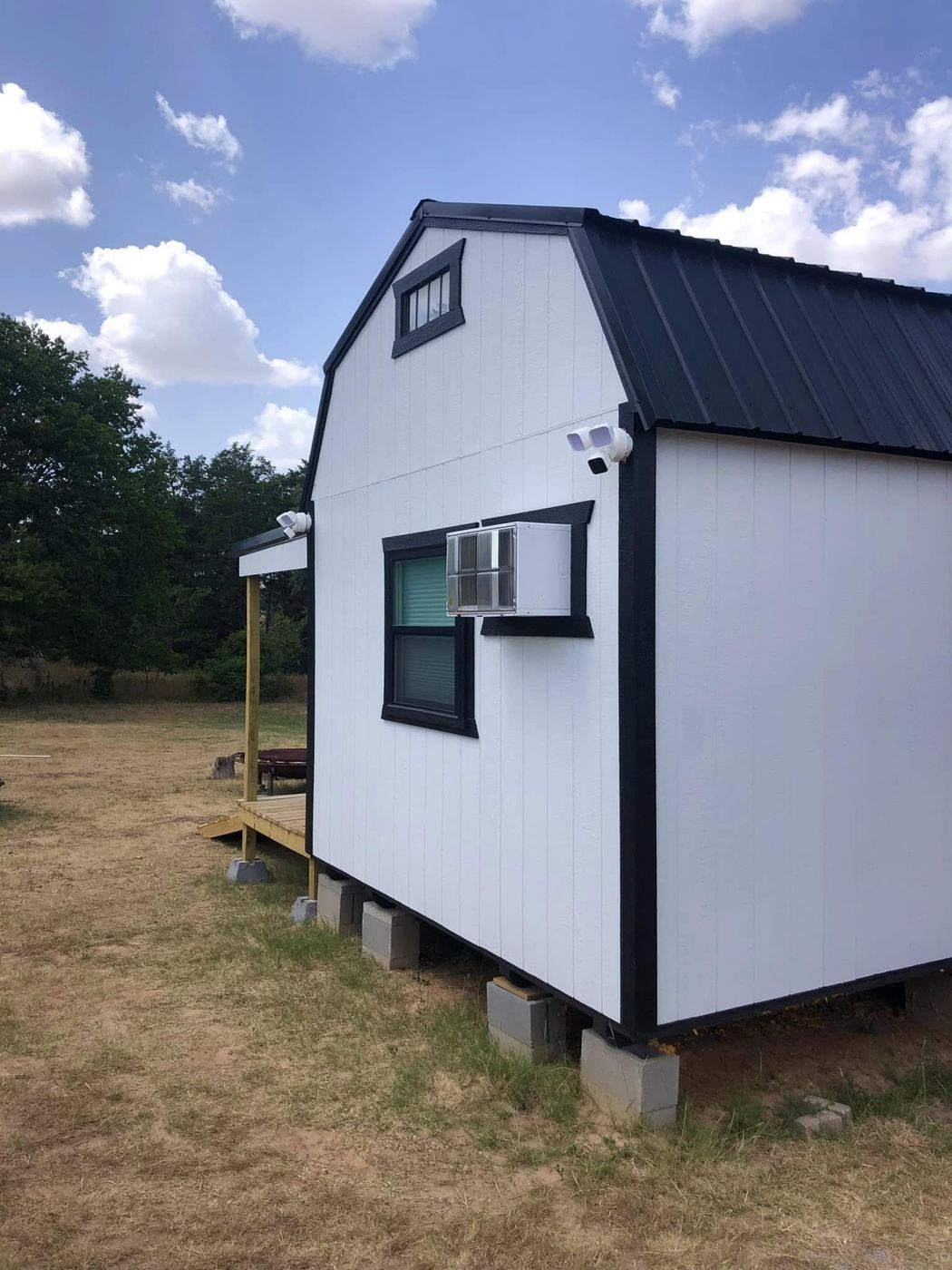 Finished Tiny House: Wired, plumbed and set on a block foundation, ready to live in.